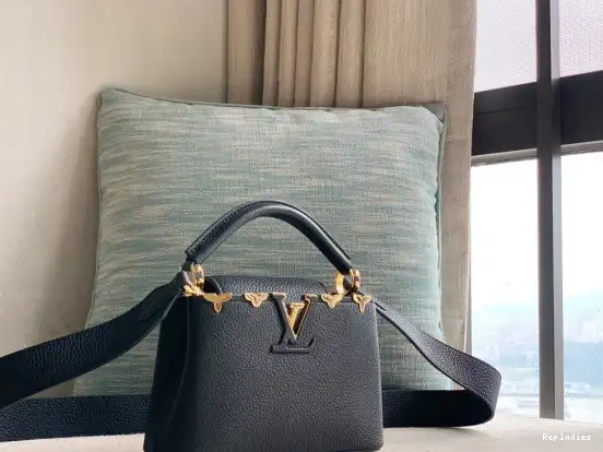 Repladies offers premium fake Louis bags at unbeatable prices. Our products are cheap because we focus on direct sales VUITTON MINI CAPUCINES LOUIS 0214